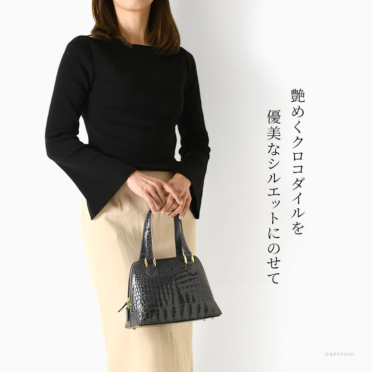 艶めくラージクロコダイルを一頭分贅沢に使用した優美なシルエットのボリードバッグ。幅広い装いに合わせやすい黒に近いブルーグレーのハンドバッグ